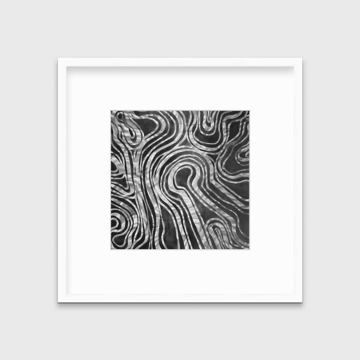 A dark grey and white abstract print in a white frame with a mat hangs on a white wall.