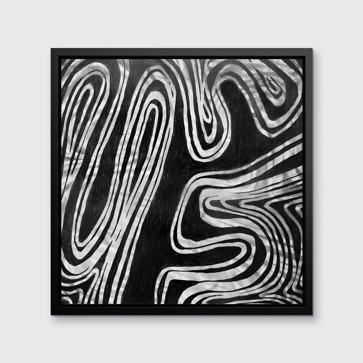 A black and white abstract print in a black floater frame hangs on a white wall.
