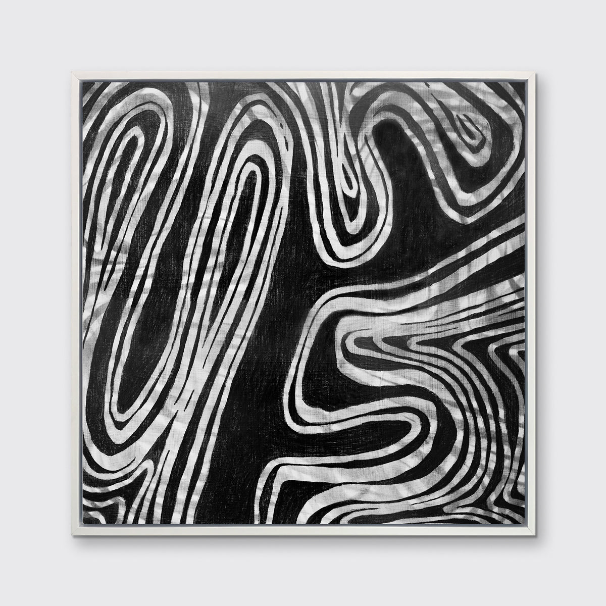 A black, grey and white abstract print in a white floater frame hangs on a white wall.