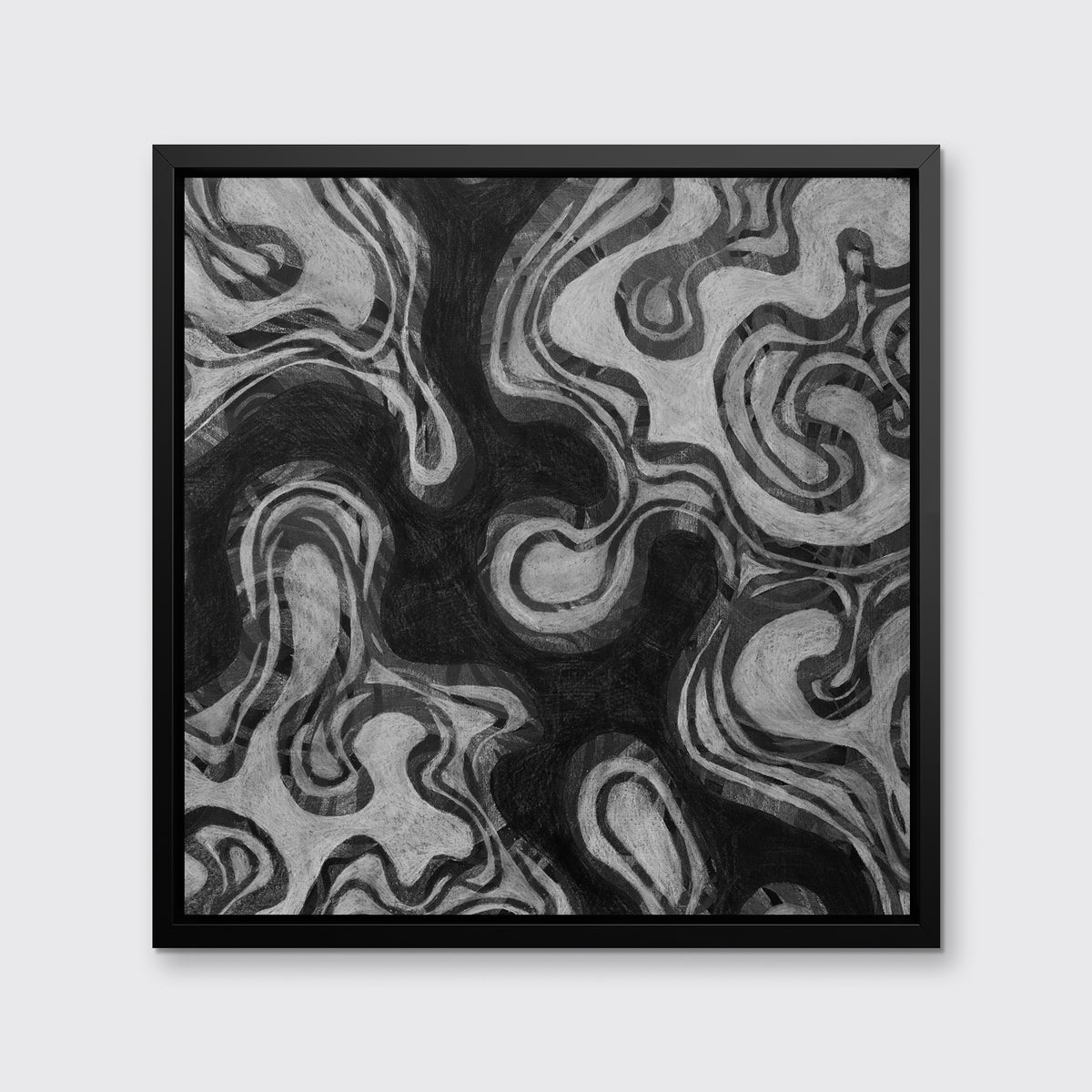 A black and grey abstract print in a black floater frame hangs on a white wall.