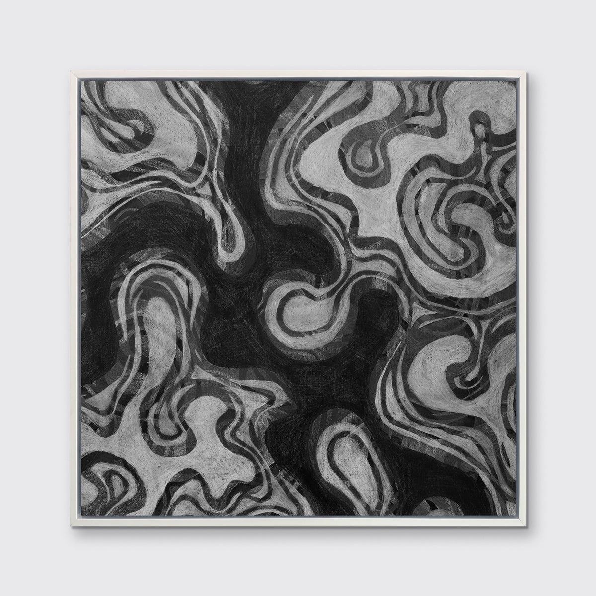A black and grey abstract print in a white floater frame hangs on a white wall.