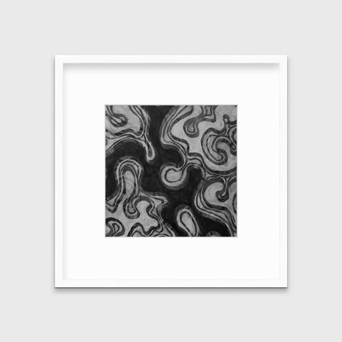 A black and grey abstract print in a white frame with a mat hangs on a white wall.