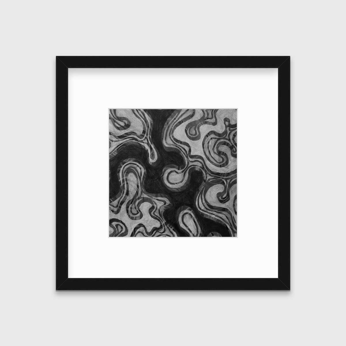 A black and grey abstract print in a black frame with a mat hangs on a white wall.