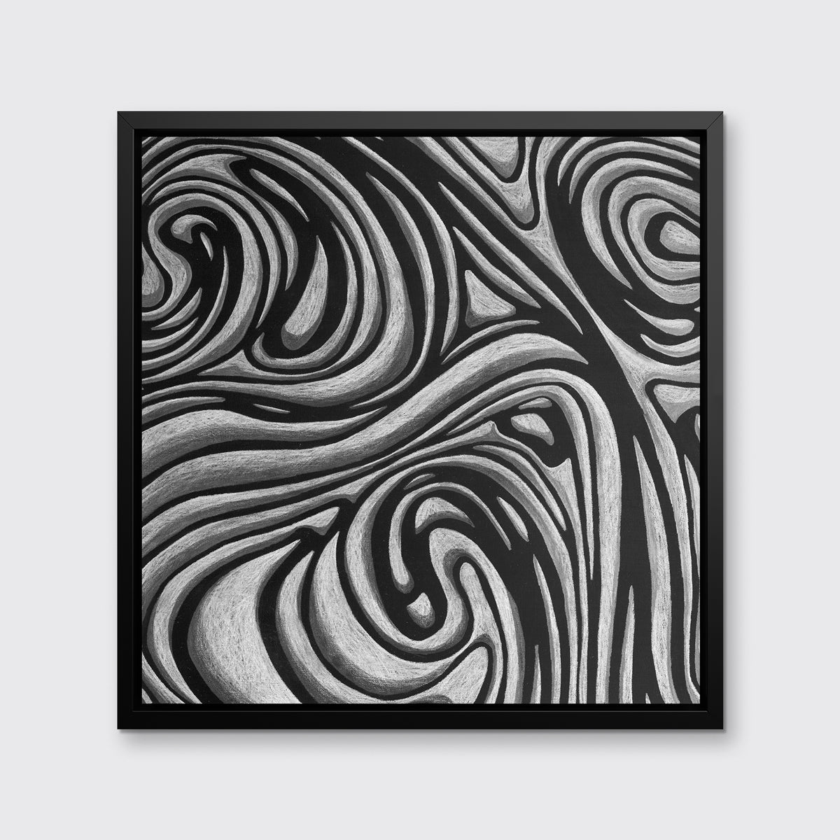 A black and grey abstract print in a black floater frame hangs on a white wall.