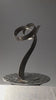 Video of abstract, steel sculpture rotating on stand to view from all angles.