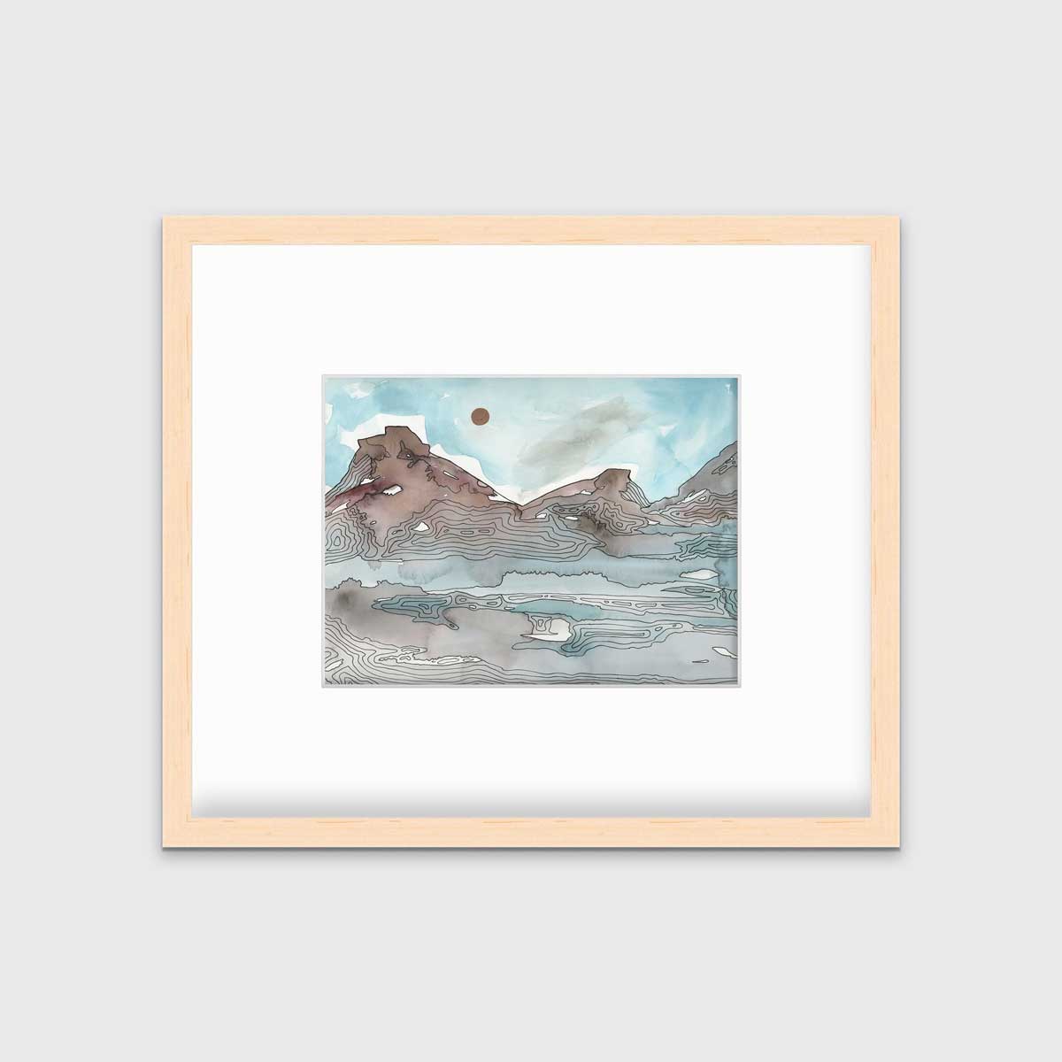 A light blue, brown and black abstract landscape illustration print in a natural wood frame with a mat hangs on a white wall.