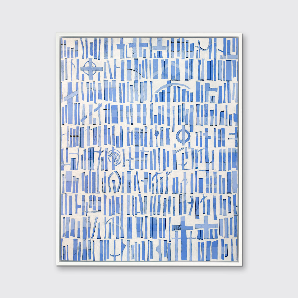 A blue and white abstract print in a white floater frame hangs on a white wall.