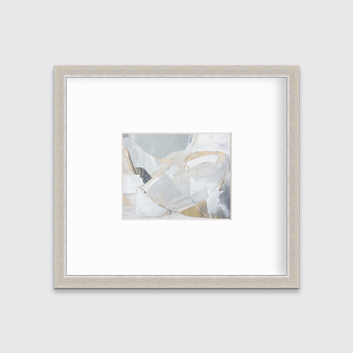A light grey, beige and white abstract print in a silver frame with a mat hangs on a white wall.