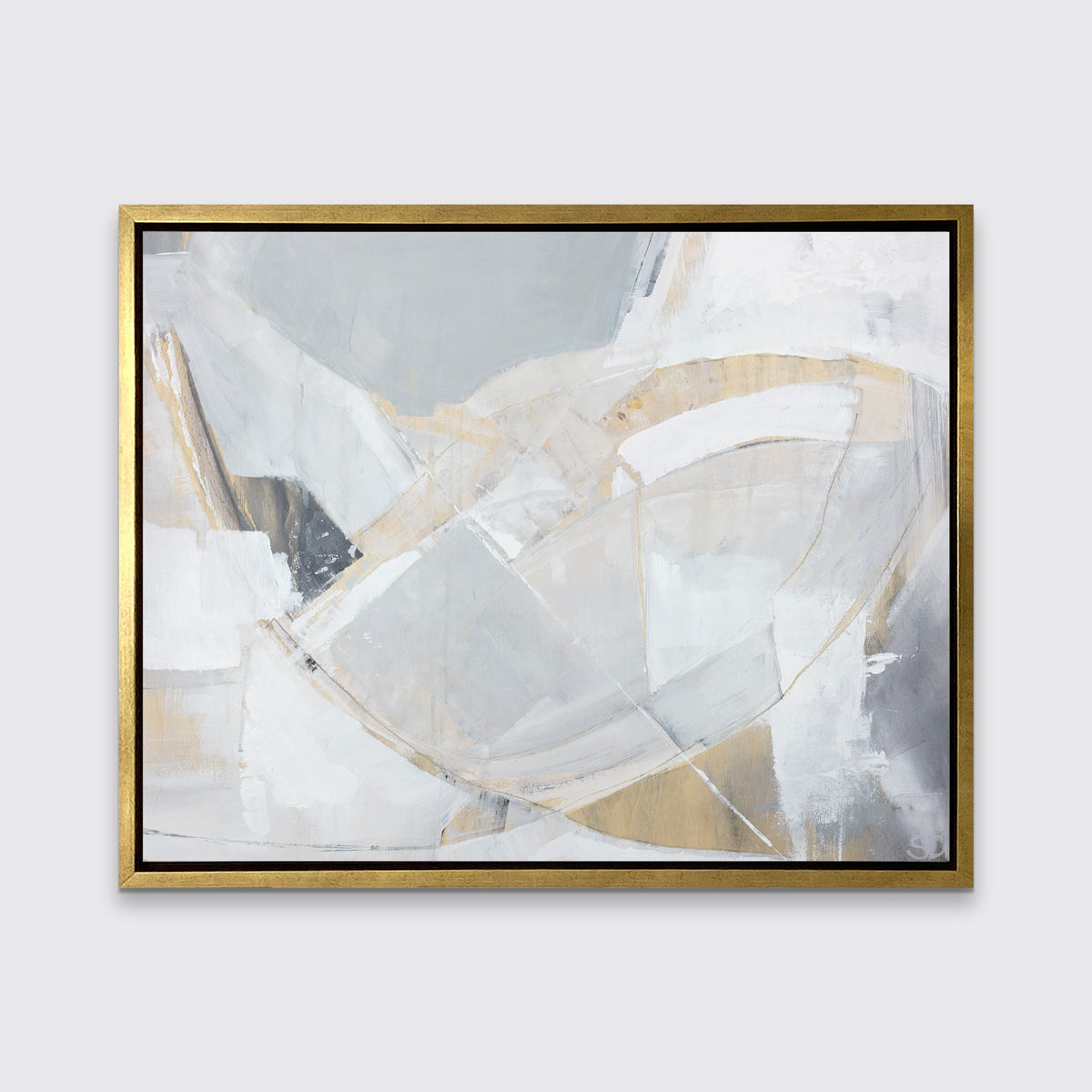 A light grey, beige and white abstract print in a gold floater frame hangs on a white wall.