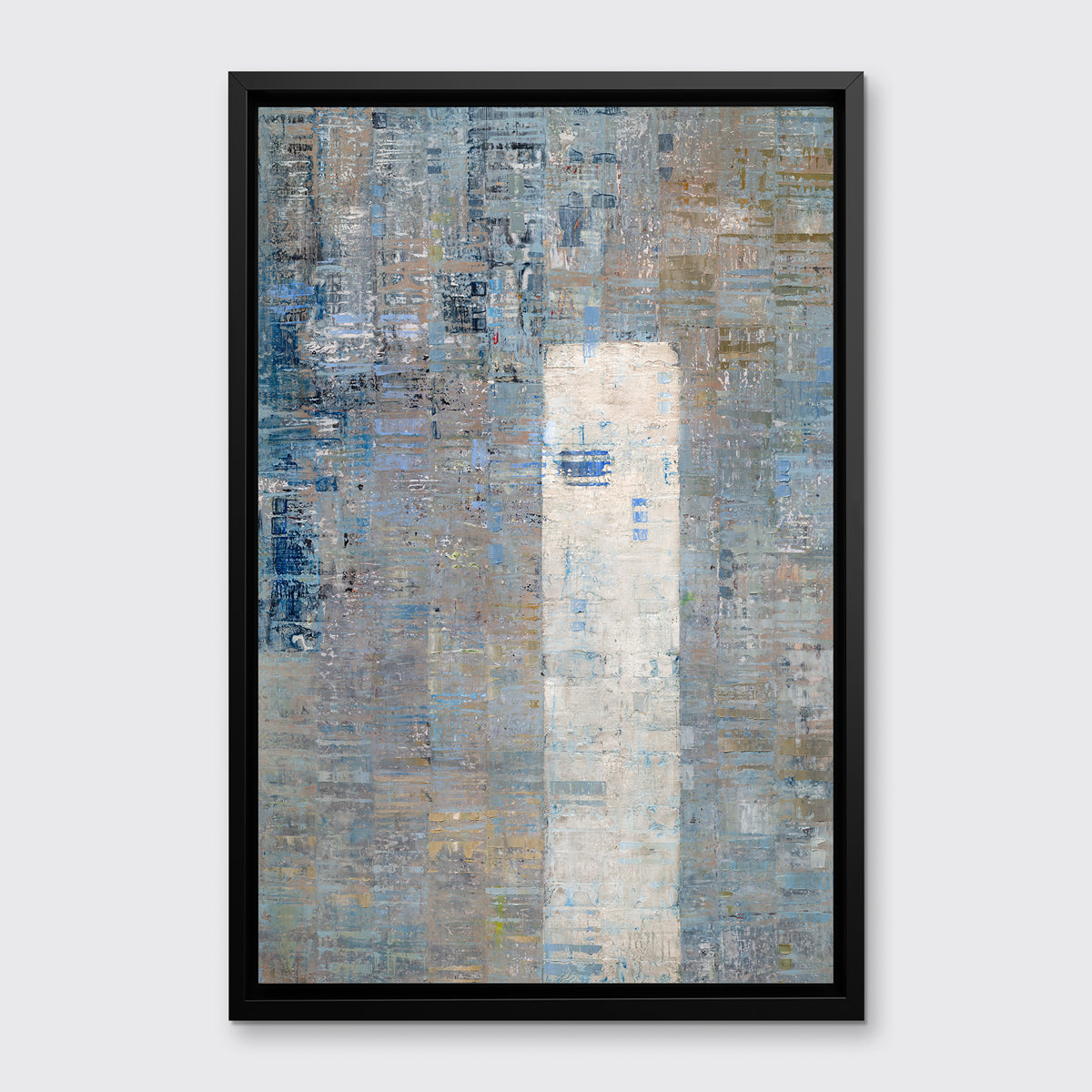 A blue and grey abstract geometric print in a black floater frame hangs on a white wall.