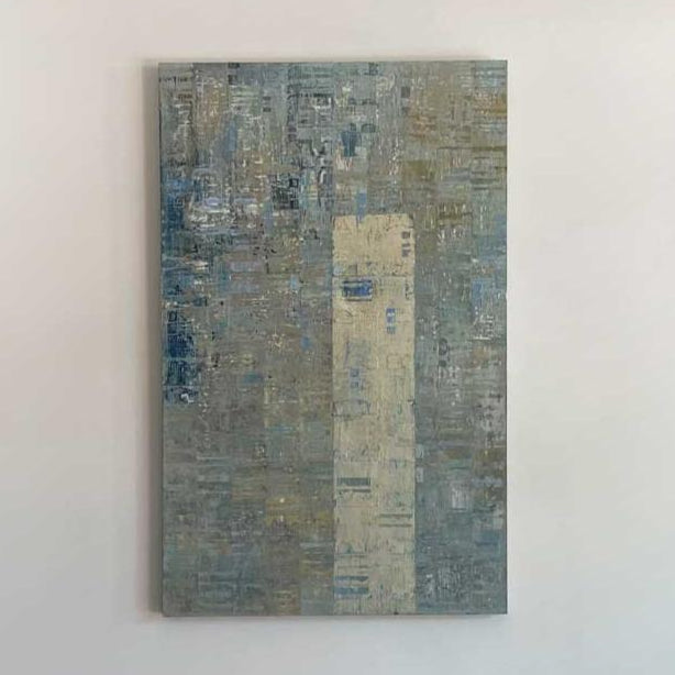 A blue and grey abstract painting with a silver leaf detail by Ned Martin hangs on a white wall with a view from straight on. 