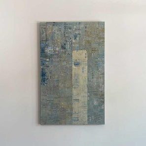 A blue and grey abstract painting with a silver leaf detail by Ned Martin hangs on a white wall with a view from straight on. 