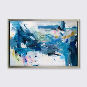 A blue, yellow and white abstract print in a silver floater frame hangs on a white wall.