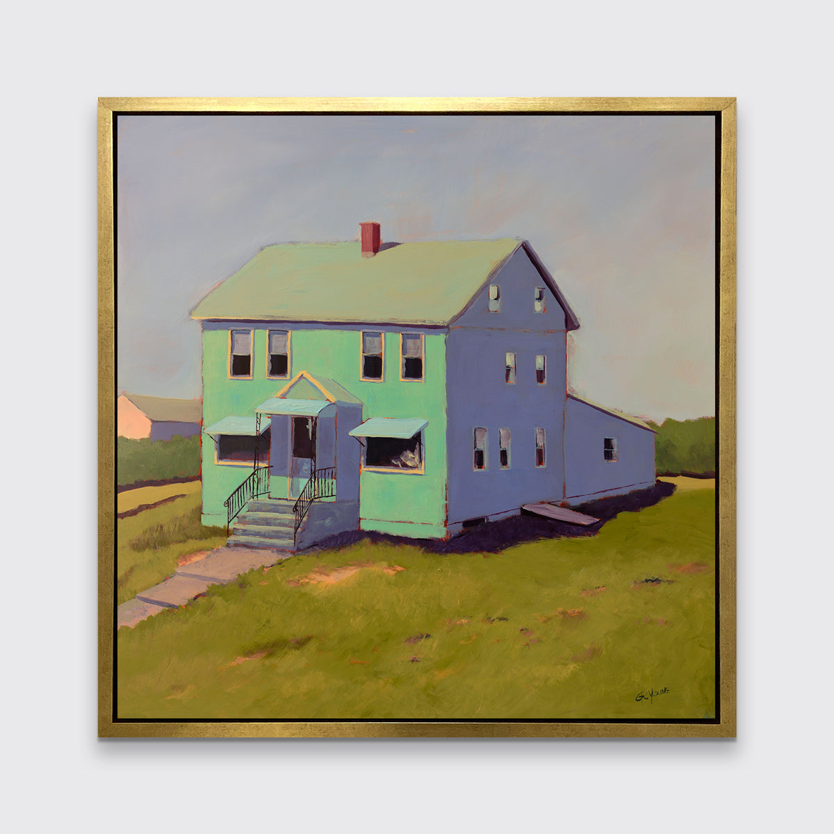 A seafoam green, blue and chartruse contemporary house print in a gold floater frame hangs on a white wall.