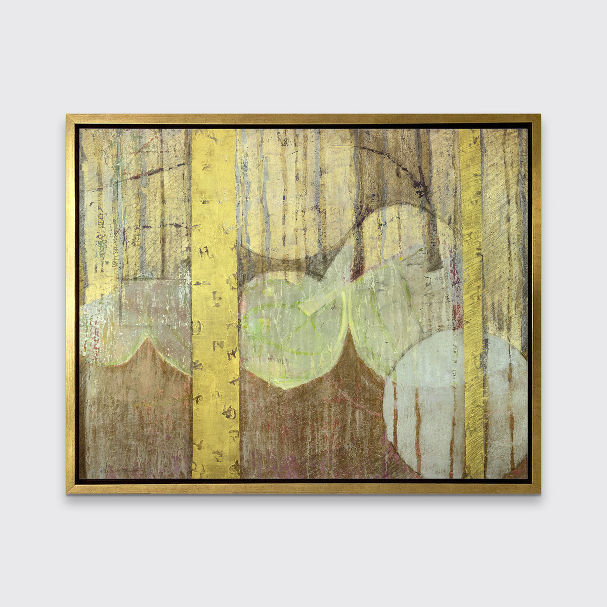 A gold, yellow, light green and light blue abstract print in a gold floater frame hangs on a white wall.