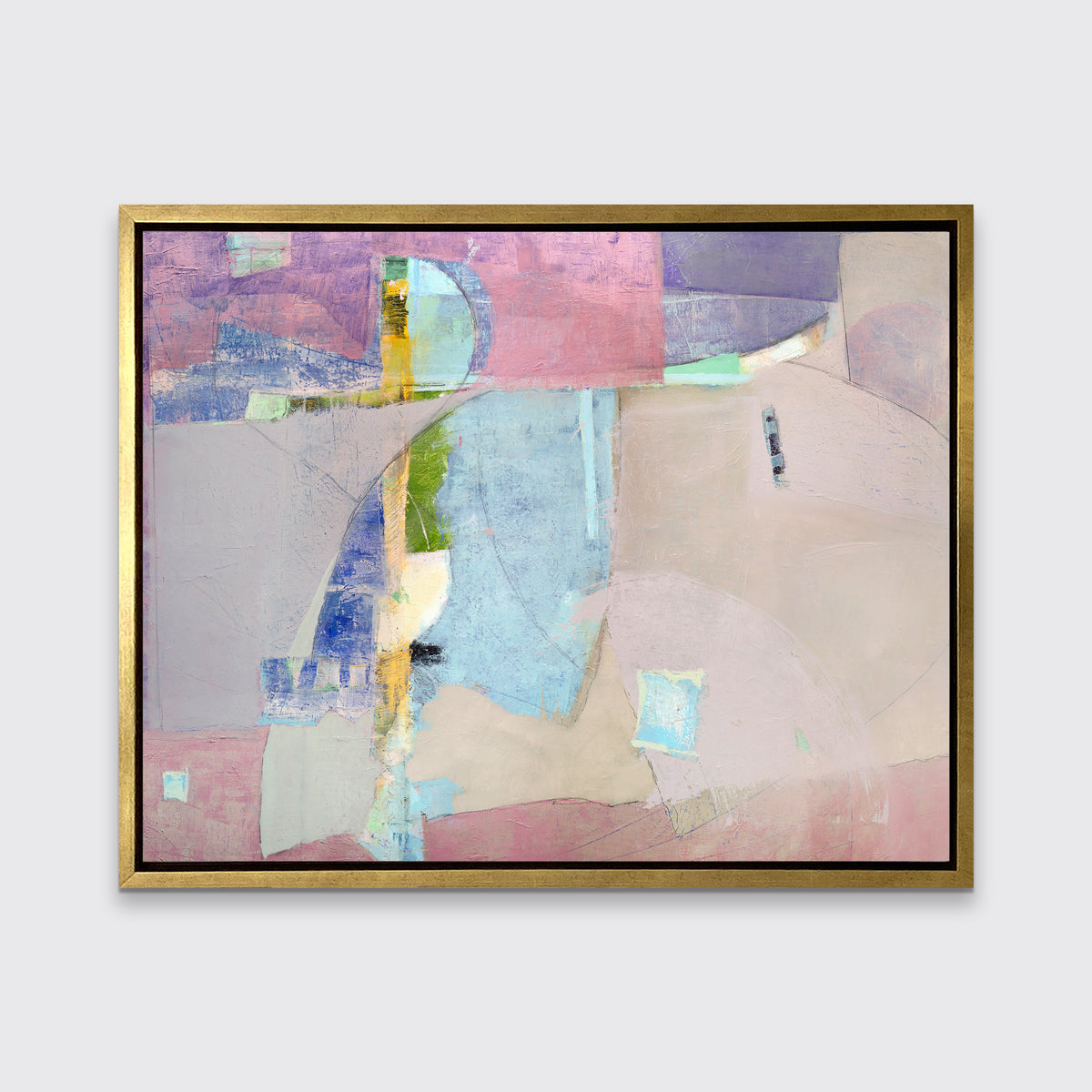 A pink, light blue, green and purple abstract print in a gold floater frame hangs on a white wall.