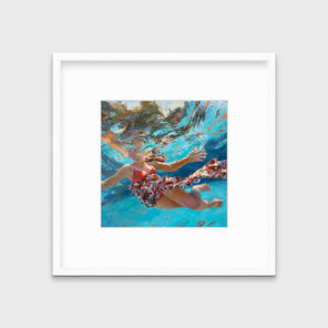 A colorful distorted figurative print of a girl underwater in a white frame with a mat hangs on a white wall.