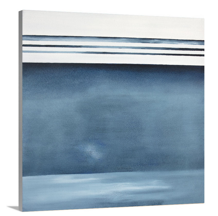 Side-angle view of a blue and white abstract painting on a canvas.