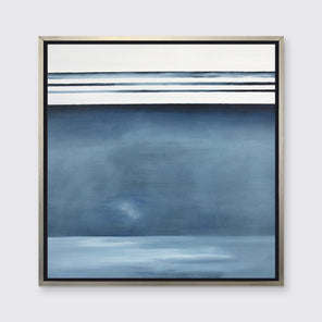 Blue and white abstract painting in a silver floater frame hangs on a white wall.