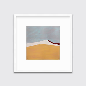 A dark yellow, white, dark red and slate blue abstract landscape print in a white frame with a mat hangs on a white wall.