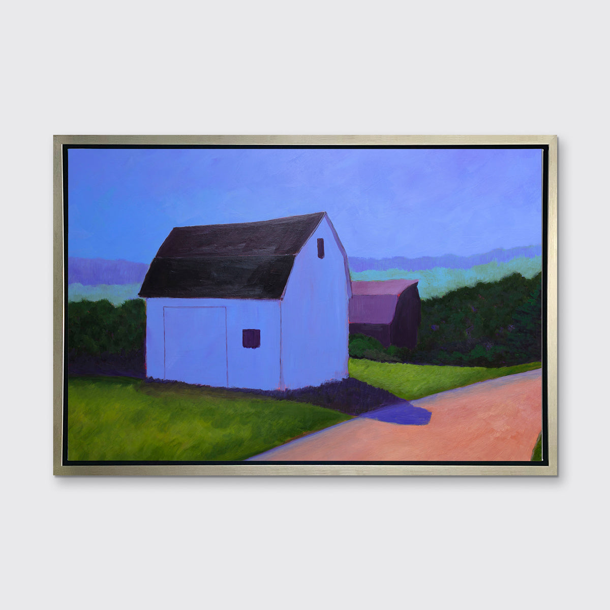 A blue, green and peach contemporary barn print in silver floater frame hangs on a white wall.