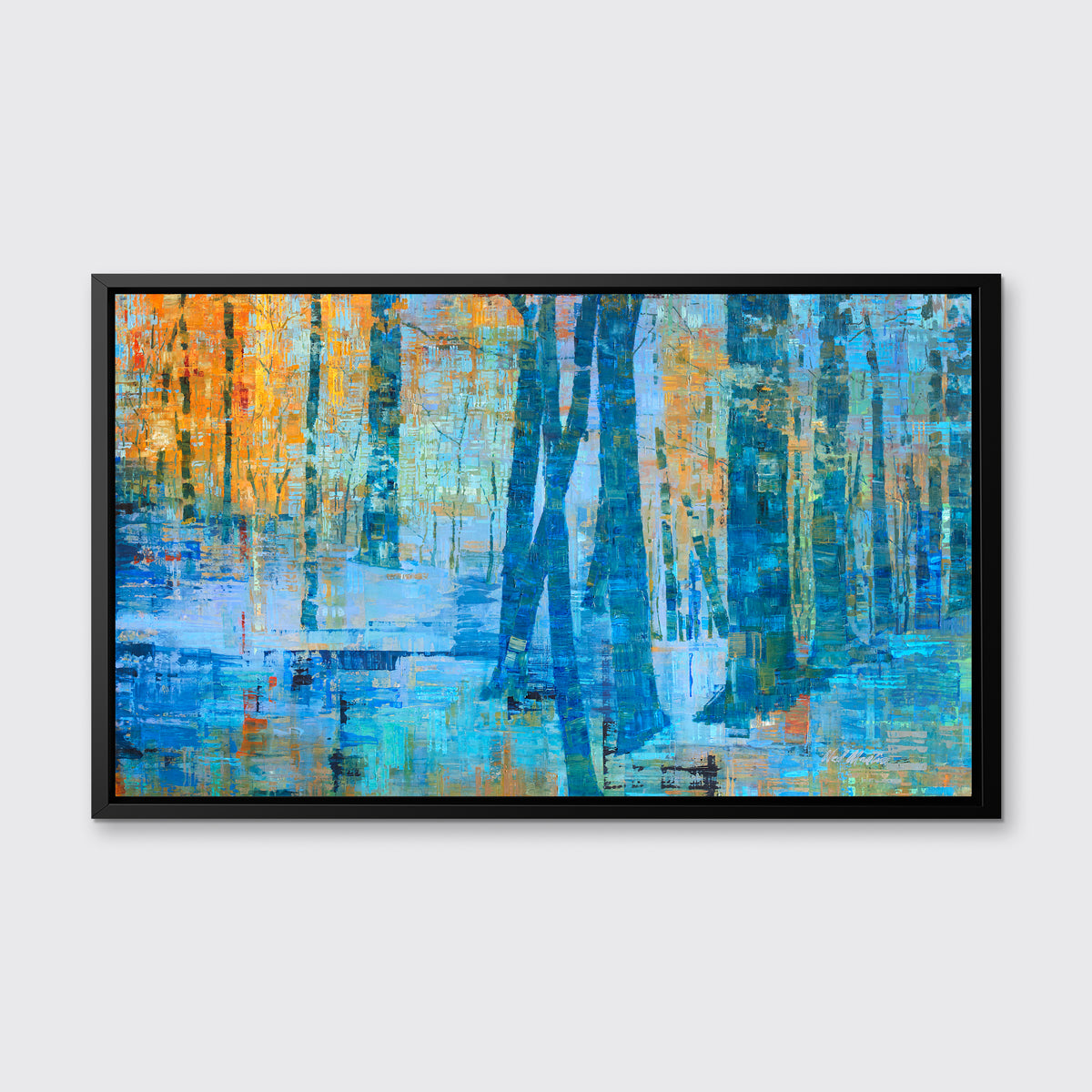 A blue, green and orange abstract tree landscape print in a black floater frame hangs on a white wall.