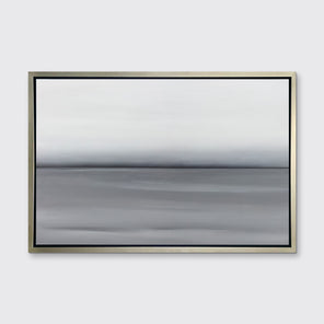 A grey toned abstract landscape print in a silver floater frame hangs on a white wall.