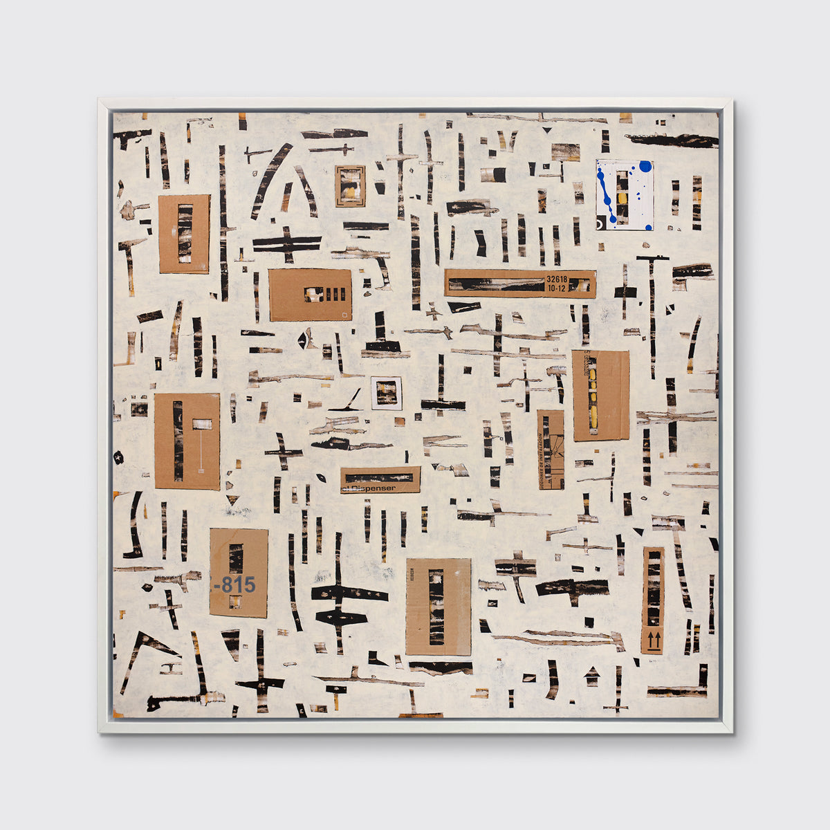A brown and black abstract print in a white floater frame hangs on a white wall.