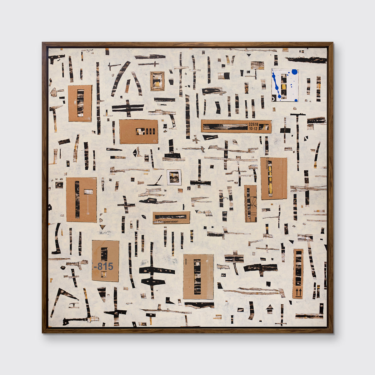 A brown and black abstract print in an oak wood floater frame hangs on a white wall.