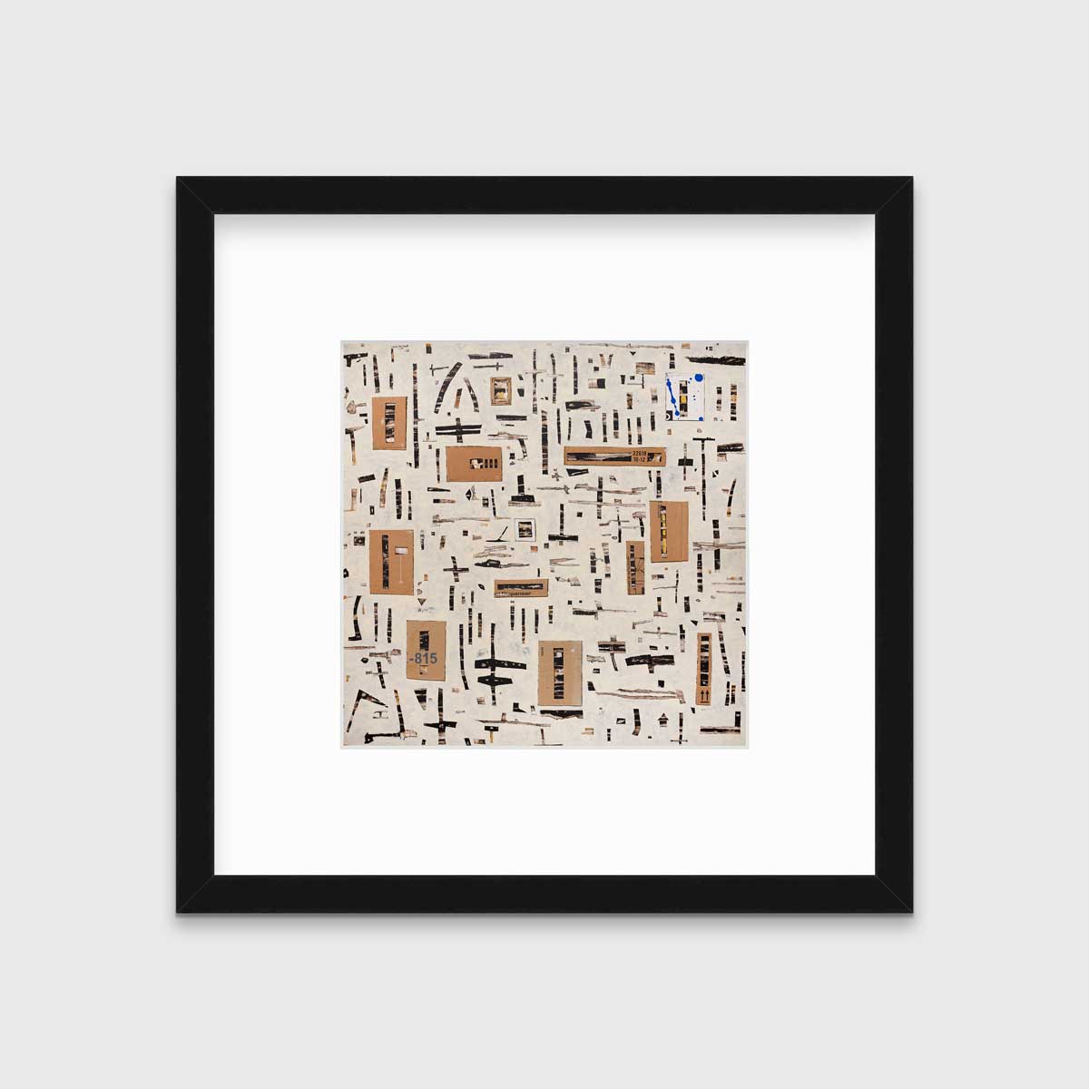 A brown and black abstract print in a black frame with a mat hangs on a white wall.