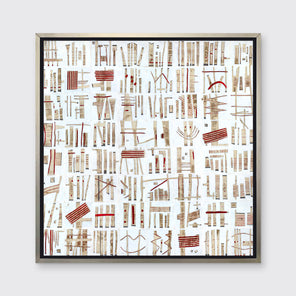 A white, beige and red abstract print in a silver floater frame hangs on a white wall.