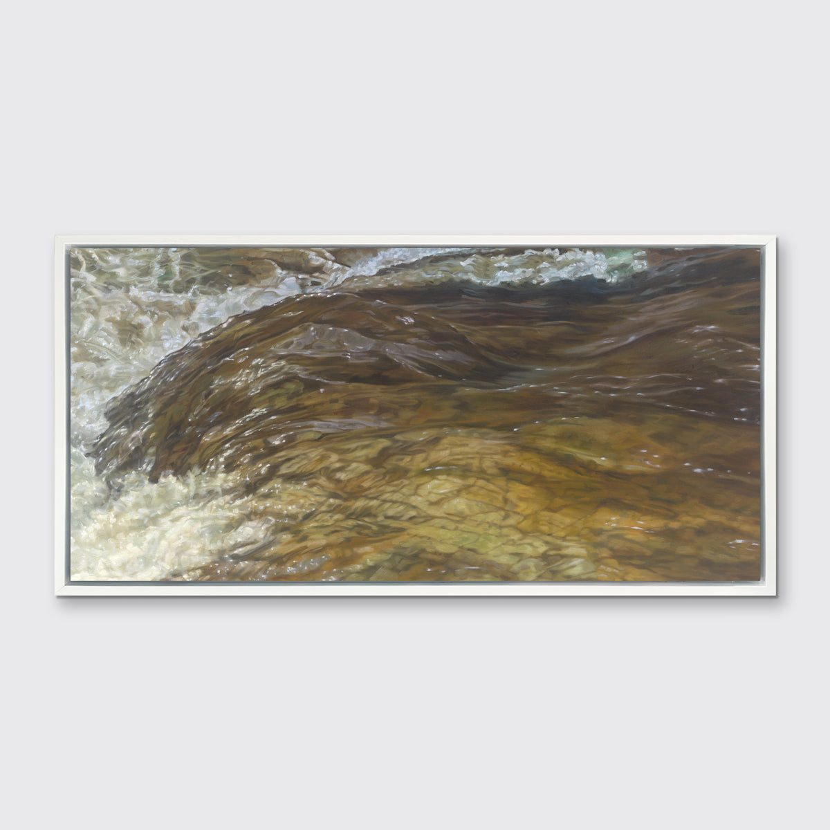 A brown, beige and white abstract river print in a white floater frame hangs on a white wall.
