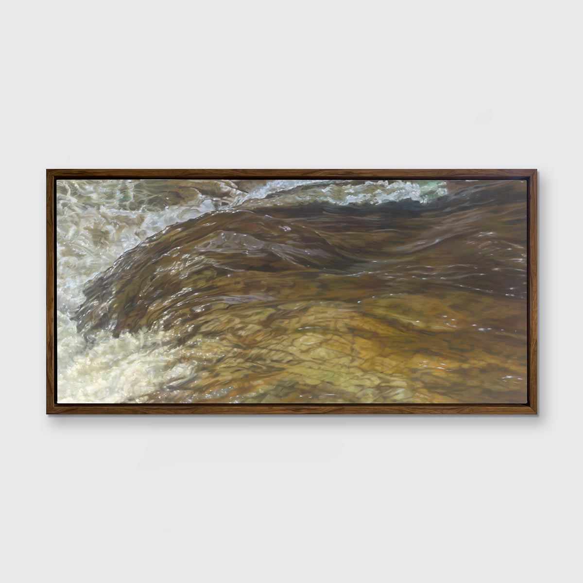 A brown, beige and white abstract river print in an oak wood floater frame hangs on a white wall.