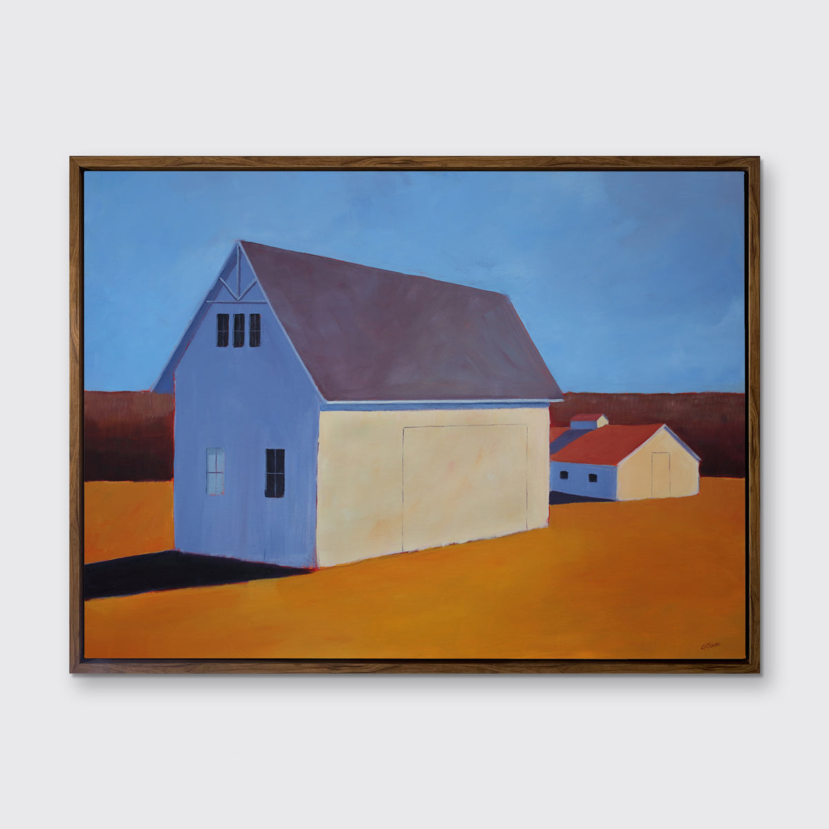 A blue, dark orange, beige and lavender contemporary barn print in an oak wood floater frame hangs on a white wall.
