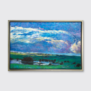 A blue and green abstract landscape print in a silver floater frame hangs on a white wall.