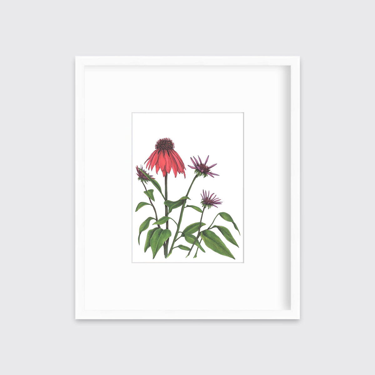 Red and purple flowers with green stems and leaves print in a white frame with a mat hangs on a white wall.