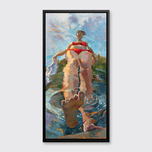 A colorful distorted figurative of a girl putting one foot into the water in a black floater frame hangs on a white wall.