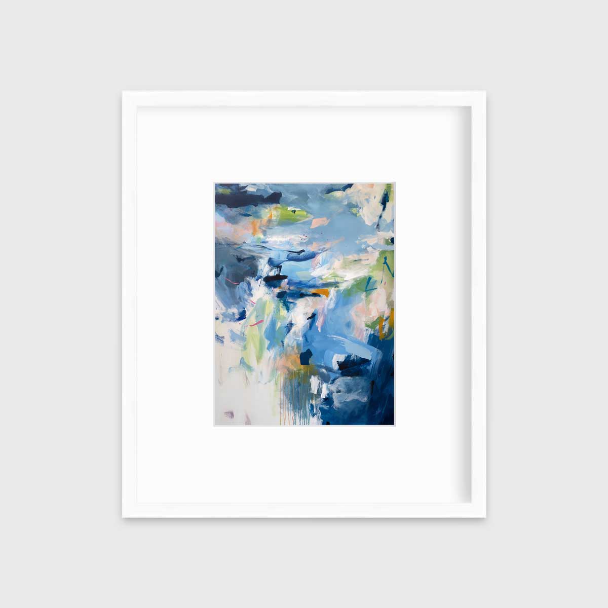A blue abstract print by Kelly Rossetti in a white frame with a mat hangs on a white wall.