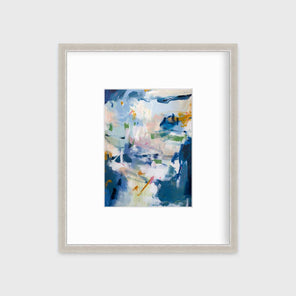 A blue abstract print in a silver frame with a mat hangs on a white wall.