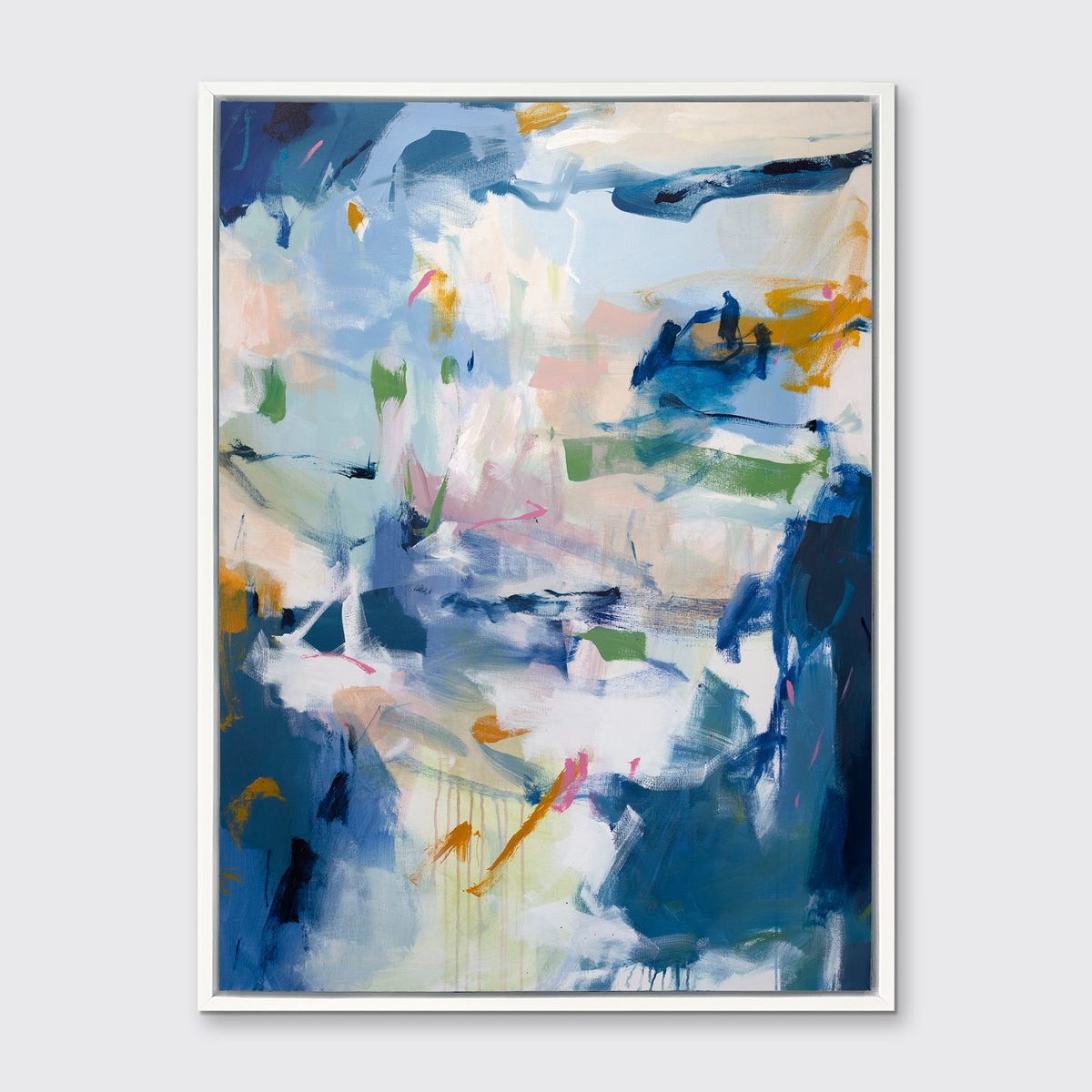 A blue, green and white abstract print in a white floater frame hangs on a white wall.