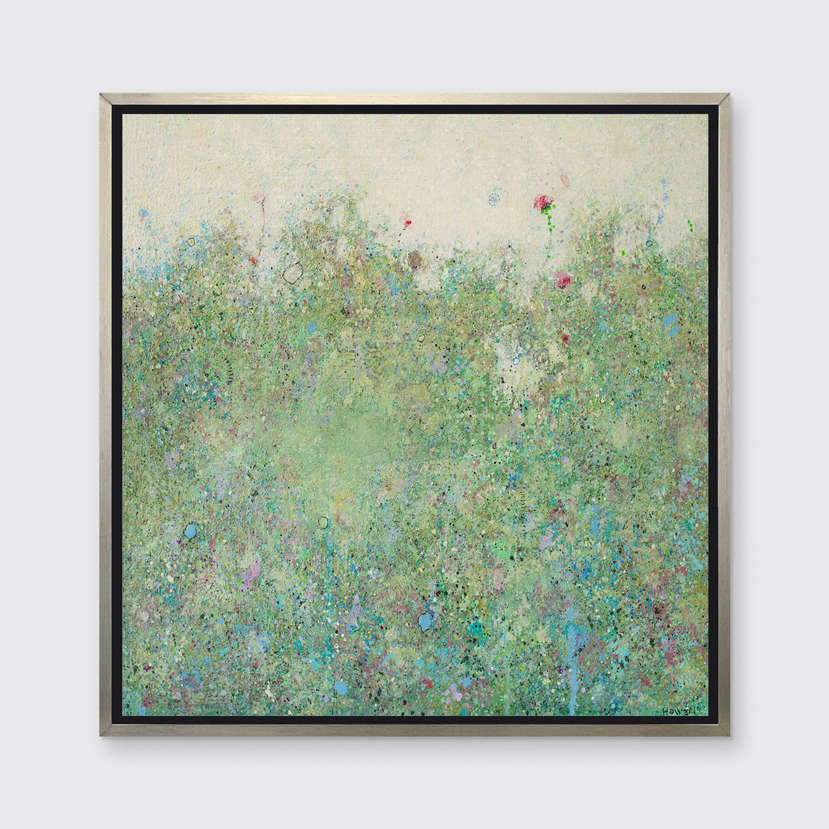 A green abstract landscape in a silver floater frame hangs on a white wall.