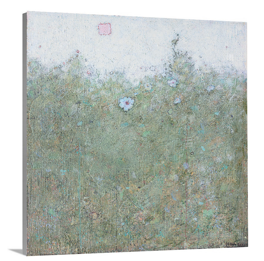 A side-angle view of a green and blue abstract landscape print on canvas.