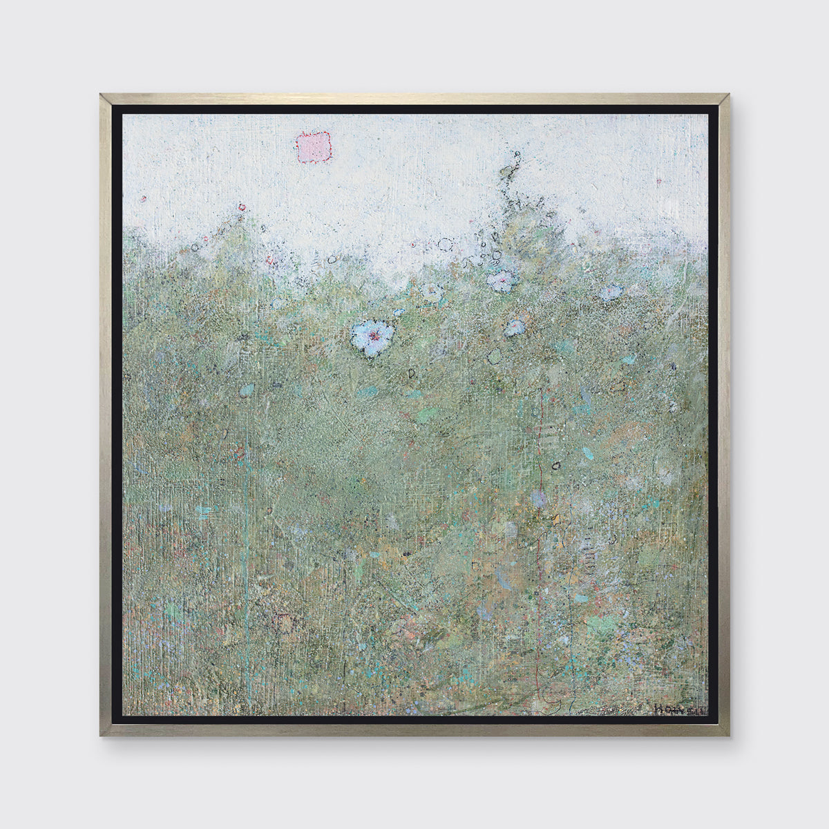 A green and blue abstract landscape with a blue flower in a silver floater frame hangs on a white wall.