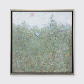 A green and blue abstract landscape with a blue flower in a silver floater frame hangs on a white wall.