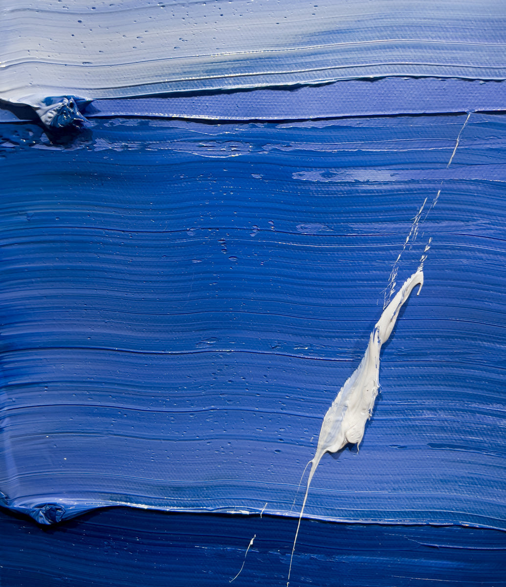 A close up detail shot of a blue and white textured abstract painting by Teodora Guererra.