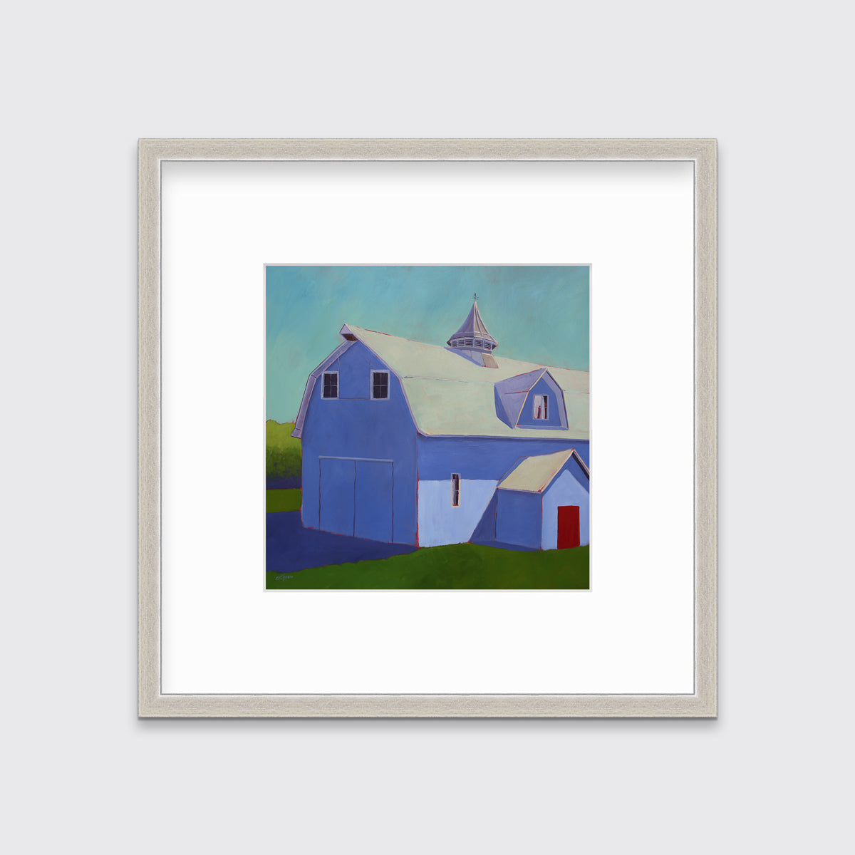 A light blue, lavender and beige contemporary barn print in a silver frame with a mat hangs on a white wall.