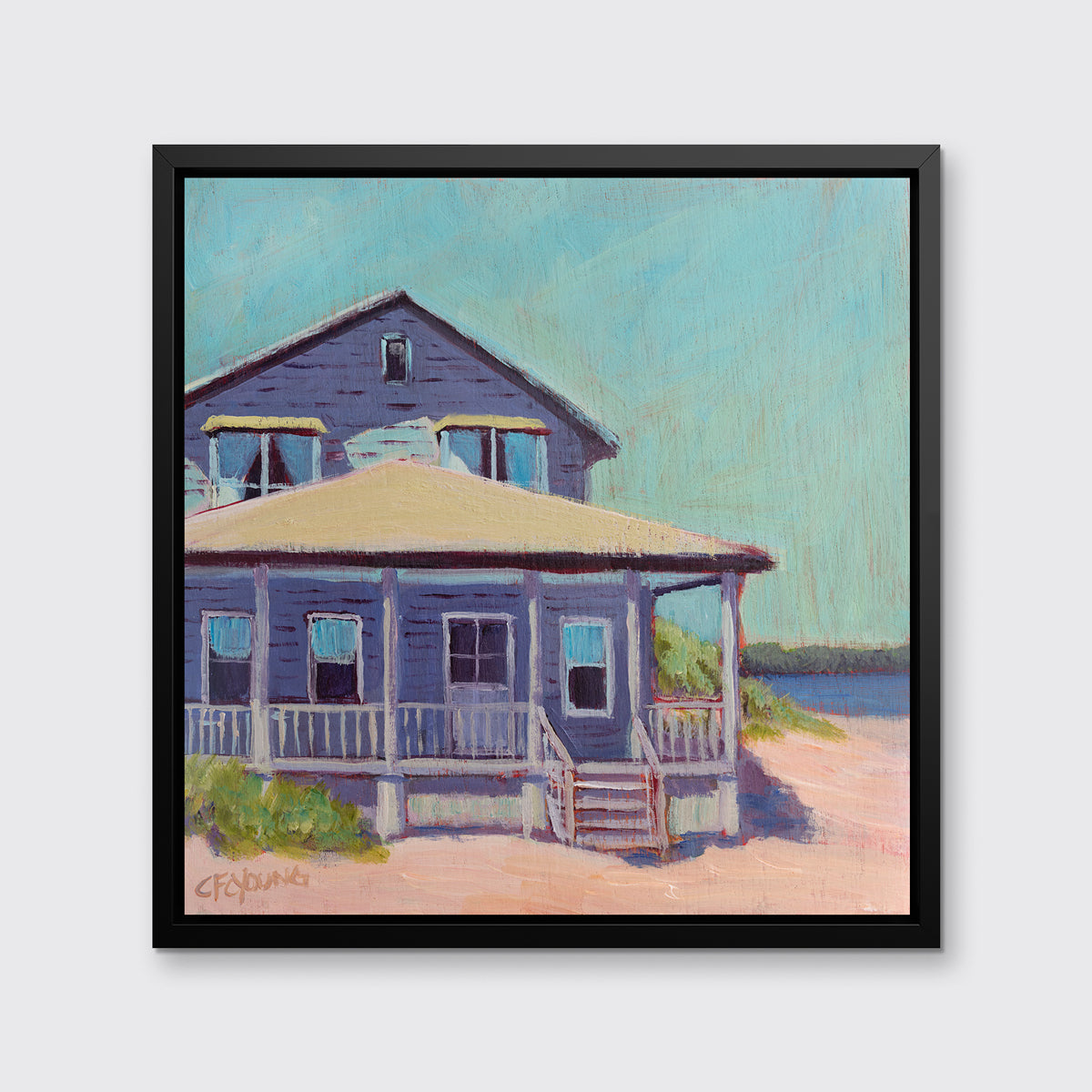 A teal, purple, beige and rose contemporary beach house print in a black floater frame hangs on a white wall.