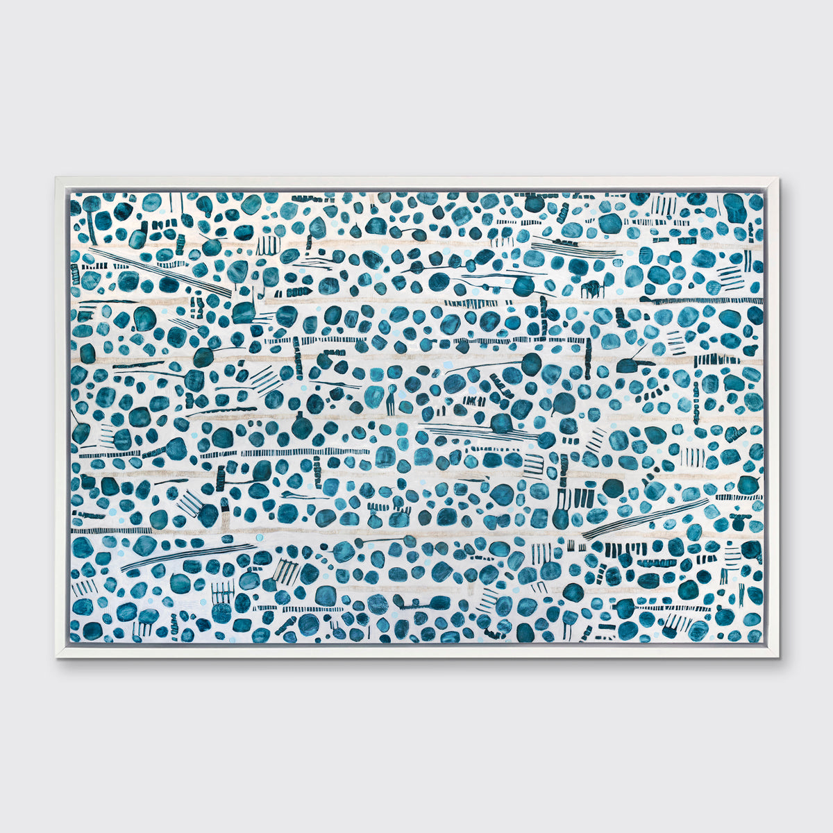A dark teal, white and beige abstract print in a white floater frame hangs on a white wall.