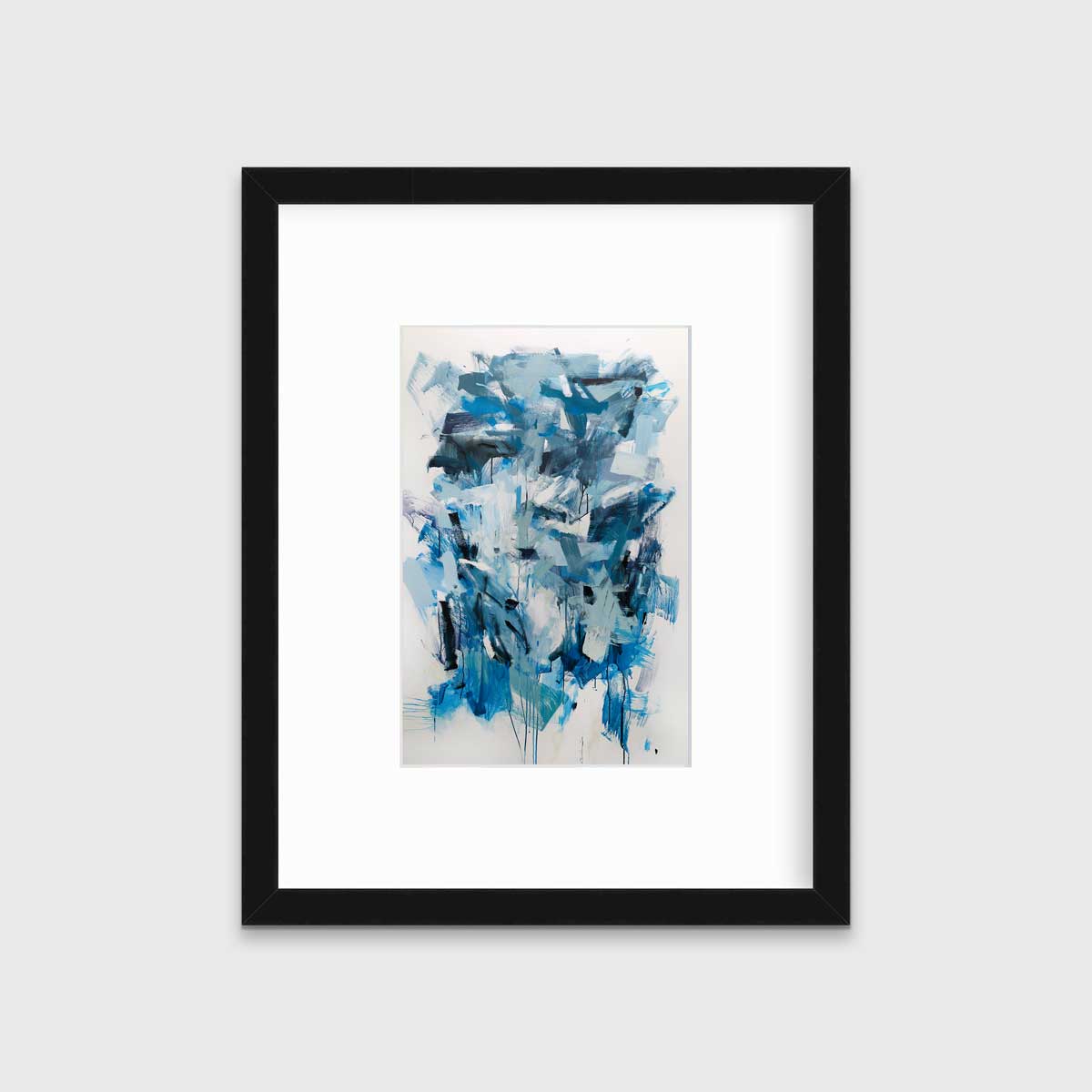 A blue, teal and white abstract print in a black frame with a mat hangs on a white wall.