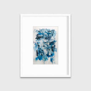 A blue, teal and white abstract print in a white frame with a mat hangs on a white wall.